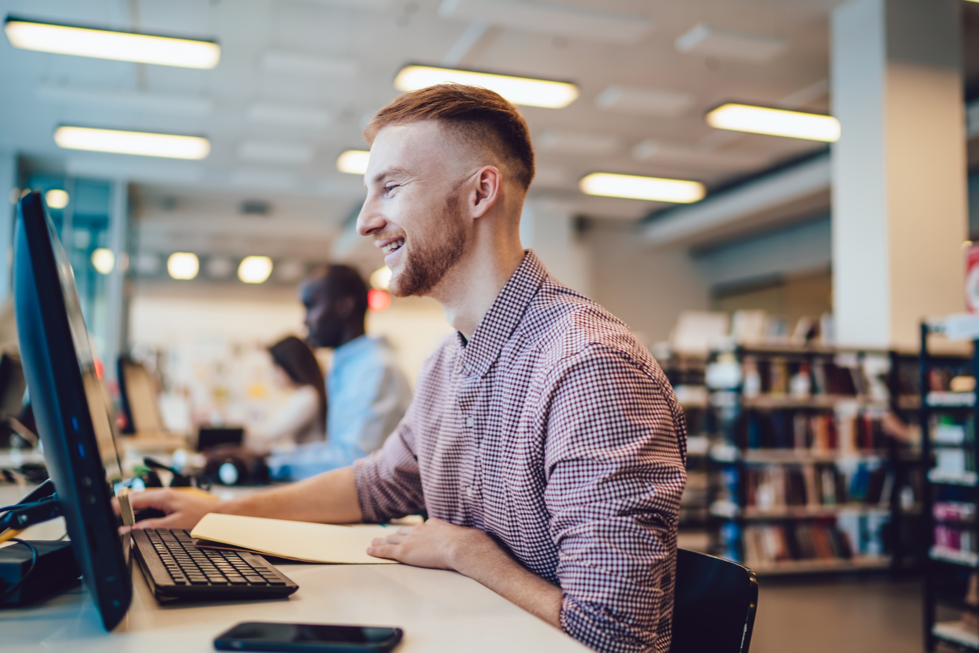 Happy mates surfing PC in library